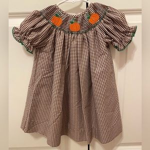Southern Sunshine smocked bishop dress. NWOT, never worn. 12m